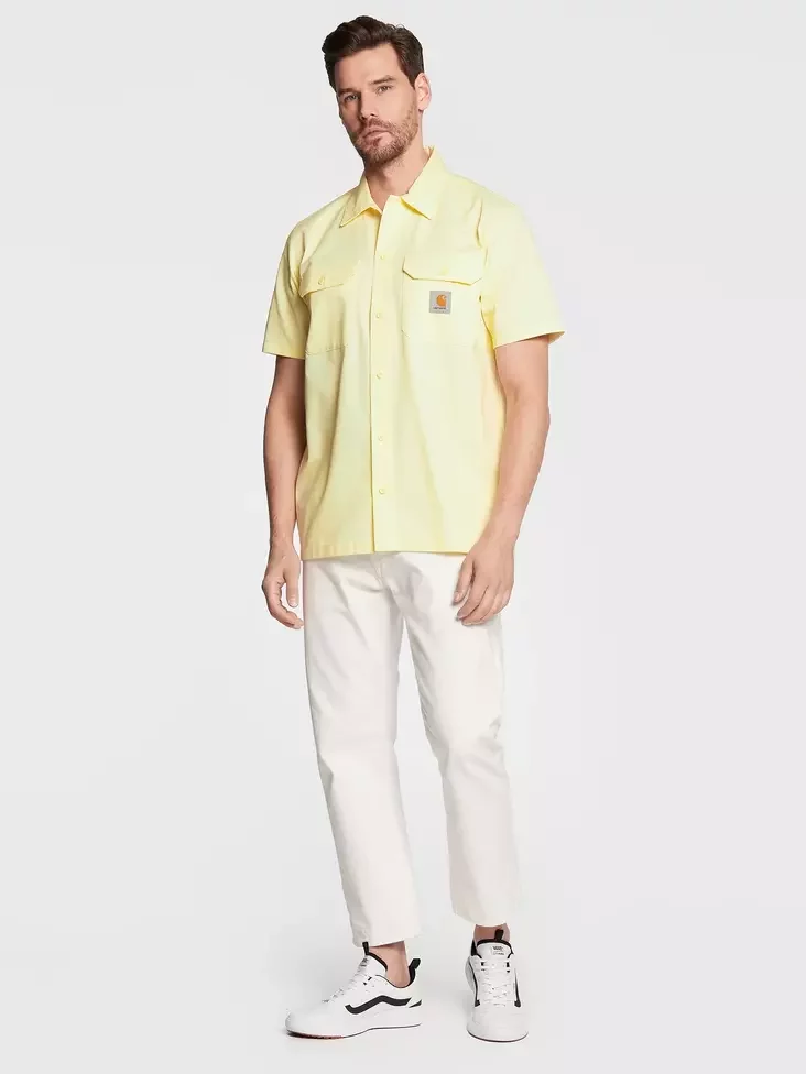 man in a light yellow shirt